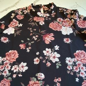 Size small black with floral pattern blouse with long ruffle sleeve